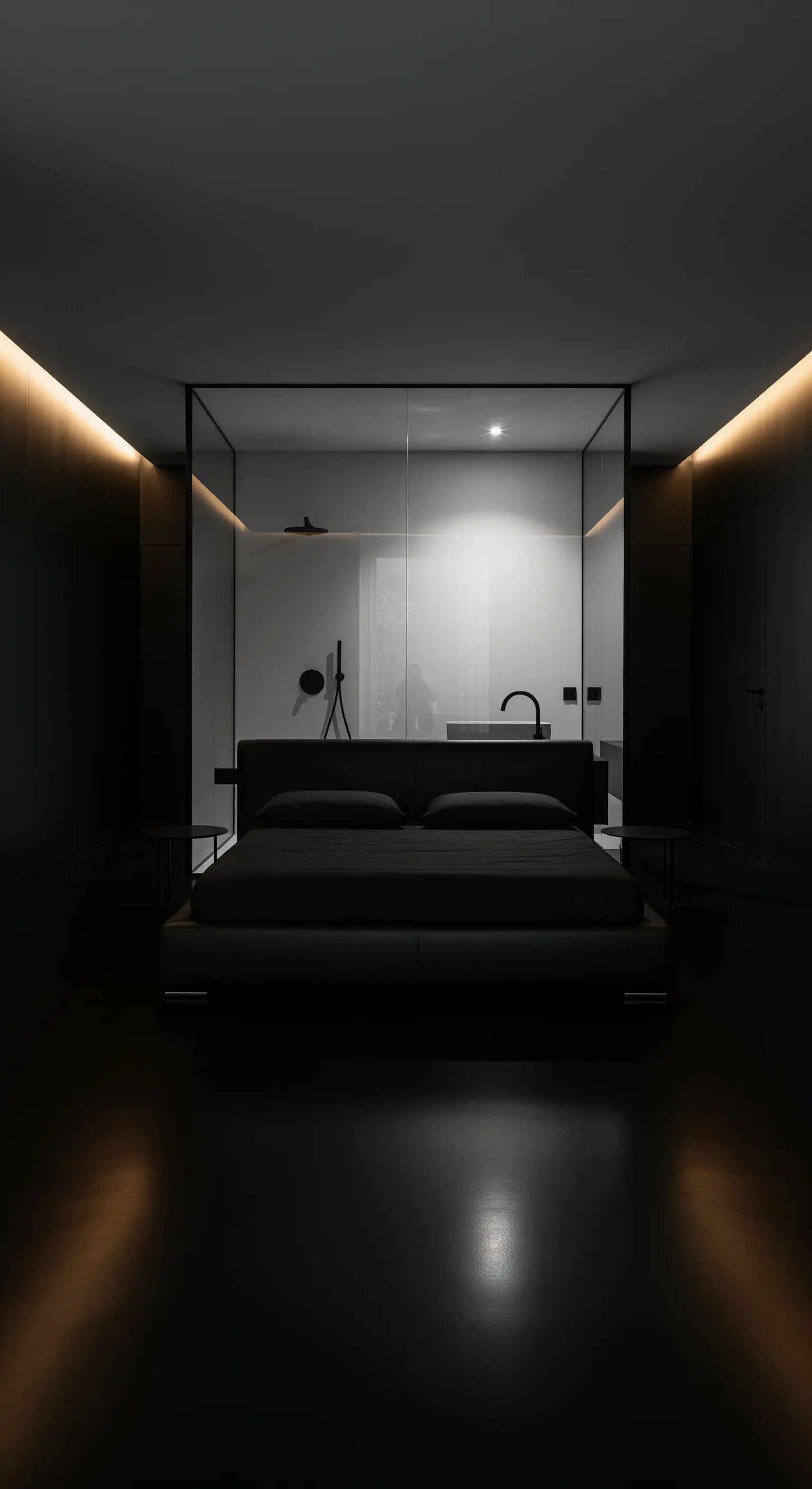 Minimalistisches Schlafzimmer mit schwarzem Bett und gläserner Badezimmerabtrennung